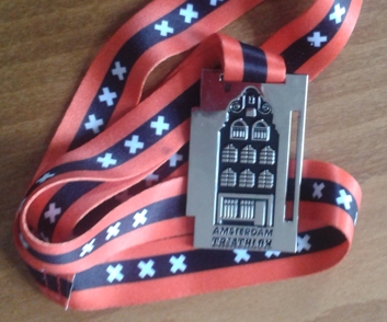 Medaille met Amsterdams grachtenpand